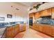 Spacious kitchen featuring wooden cabinetry, granite countertops, and stainless steel appliances at 15241 E Pageland Cir, Fountain Hills, AZ 85268