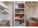 Organized linen closet with shelves and boxes at 15241 E Pageland Cir, Fountain Hills, AZ 85268