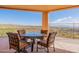 Inviting covered patio with a stylish outdoor dining set, perfect for enjoying the scenic views at 15241 E Pageland Cir, Fountain Hills, AZ 85268