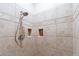 Tiled shower stall with a handheld shower head and built-in soap niche at 15241 E Pageland Cir, Fountain Hills, AZ 85268