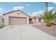 Spacious two-car garage and a landscaped yard at 15525 W Clear Canyon Dr, Surprise, AZ 85374