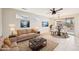 Bright living room featuring neutral tones, tiled floor, modern decor, and plenty of natural light at 15525 W Clear Canyon Dr, Surprise, AZ 85374