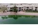 Aerial view of lakeside community featuring residential buildings with stunning water views at 16013 S Desert Foothills Pkwy # 2082, Phoenix, AZ 85048