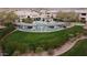 Aerial view of community amenities including pool, BBQ area, putting green and lush green spaces at 16013 S Desert Foothills Pkwy # 2082, Phoenix, AZ 85048