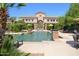 Beautiful community pool and clubhouse with luxurious amenities and lush landscaping at 16013 S Desert Foothills Pkwy # 2082, Phoenix, AZ 85048