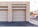 Attached single-car garage with a neutral door and adjacent parking space at 16013 S Desert Foothills Pkwy # 2082, Phoenix, AZ 85048