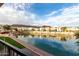 Picturesque view of the lake, with community homes visible in the background at 16013 S Desert Foothills Pkwy # 2082, Phoenix, AZ 85048