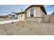 Charming single-Gathering home featuring a two-car garage and neutral stucco exterior with stone accents at 16036 W Desert Hollow Dr, Surprise, AZ 85387