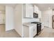 Open kitchen featuring white cabinets, stainless steel appliances, and granite countertops at 16036 W Desert Hollow Dr, Surprise, AZ 85387