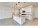 Spacious kitchen featuring granite countertops, modern lighting, and a large center island at 16036 W Desert Hollow Dr, Surprise, AZ 85387