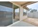 Covered patio looks out to the backyard in a new build at 16036 W Desert Hollow Dr, Surprise, AZ 85387