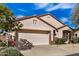 Attractive single-story home with desert landscaping, a two-car garage, and a well-kept exterior at 16172 W Starlight Dr, Surprise, AZ 85374