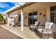 Covered patio area with decorative furniture set and ceiling beams at 16172 W Starlight Dr, Surprise, AZ 85374