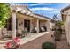 Open rear patio with table, chairs, and wicker seating under a covered trellis at 16172 W Starlight Dr, Surprise, AZ 85374