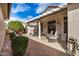 Rear covered patio area with decorative furniture set and gravel landscaping at 16172 W Starlight Dr, Surprise, AZ 85374