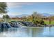 Scenic view of a water feature, golf course and mountain views at 16172 W Starlight Dr, Surprise, AZ 85374