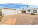 Spacious backyard with two storage sheds and desert landscaping for easy upkeep at 1640 W Charleston Ave, Phoenix, AZ 85023