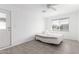 Bright bedroom features a neutral color scheme, tile flooring, and a window for natural light at 1640 W Charleston Ave, Phoenix, AZ 85023