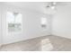 Bedroom featuring two windows with blinds and wood-look floors at 1640 W Charleston Ave, Phoenix, AZ 85023