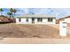 Charming single story home featuring neutral paint, gravel landscaping and a secure front door at 1640 W Charleston Ave, Phoenix, AZ 85023