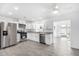 Spacious kitchen featuring stainless steel appliances, granite countertops, and white cabinets at 1640 W Charleston Ave, Phoenix, AZ 85023