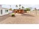 Covered patio area with brick accents and desert landscaping, ideal for outdoor entertaining at 1640 W Charleston Ave, Phoenix, AZ 85023