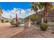 Enjoy outdoor living in this backyard featuring a barbecue, dining area, and mountain views at 16811 S 11Th Way, Phoenix, AZ 85048