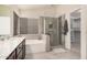 Beautiful bathroom with double sinks, tub, and glass shower at 16811 S 11Th Way, Phoenix, AZ 85048