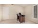 Cozy bedroom featuring a dedicated workspace with a wooden desk at 16811 S 11Th Way, Phoenix, AZ 85048