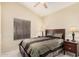 Cozy bedroom with ceiling fan and large window at 16811 S 11Th Way, Phoenix, AZ 85048