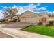 This home features a two-car garage, desert landscaping, and a well-manicured lawn at 16811 S 11Th Way, Phoenix, AZ 85048