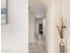 Neutral hallway with tiled flooring leading to bedrooms at 16811 S 11Th Way, Phoenix, AZ 85048