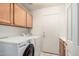 This laundry room boasts a large-capacity washer and dryer and lots of storage at 16811 S 11Th Way, Phoenix, AZ 85048