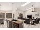 Open concept living room and kitchen area with granite countertops and stainless appliances at 16811 S 11Th Way, Phoenix, AZ 85048