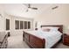 Main bedroom featuring a ceiling fan and large window at 16811 S 11Th Way, Phoenix, AZ 85048