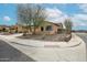 Well-maintained home showcasing desert-friendly landscaping and a convenient corner lot at 17555 W Glenhaven Dr, Goodyear, AZ 85338