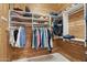 Walk-in closet with wood paneling and custom shelving at 18282 N 92Nd St, Scottsdale, AZ 85255