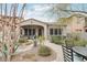 Charming home exterior with well-manicured landscaping and a inviting patio, creating curb appeal at 18282 N 92Nd St, Scottsdale, AZ 85255