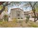 Attractive home featuring desert landscaping, a tiled roof, and convenient garage access, offering Southwestern charm at 18282 N 92Nd St, Scottsdale, AZ 85255