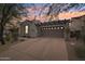 Single story home with desert landscaping, stone accents, and a two-car garage at 18282 N 92Nd St, Scottsdale, AZ 85255