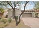 Charming home with a well-maintained yard, a two-car garage, and desert landscaping at 18282 N 92Nd St, Scottsdale, AZ 85255