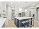 Stylish kitchen with white cabinetry, stainless steel appliances, and a large island with seating at 18282 N 92Nd St, Scottsdale, AZ 85255