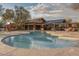 Community pool area featuring a unique shape, inviting water, and relaxing lounge spaces at 18282 N 92Nd St, Scottsdale, AZ 85255