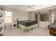 Large bedroom featuring a ceiling fan and large windows, creating a serene and inviting space at 18421 N 12Th Way, Phoenix, AZ 85022