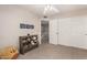 Spare bedroom featuring a ceiling fan, carpeted floor, closet and book shelves at 18421 N 12Th Way, Phoenix, AZ 85022