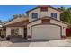 Charming two-story home featuring a red tile roof, cream stucco and an attached two-car garage at 18421 N 12Th Way, Phoenix, AZ 85022