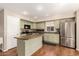 Functional kitchen with stainless steel appliances, an island and ample cabinet space at 18421 N 12Th Way, Phoenix, AZ 85022