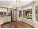 Bright kitchen nook with stainless steel appliances and a large window offering scenic outdoor views at 18421 N 12Th Way, Phoenix, AZ 85022