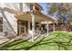 A covered patio with white pillars overlooks the landscaped backyard at 18421 N 12Th Way, Phoenix, AZ 85022