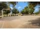 Community basketball court with trees surrounding, for neighborhood activities and recreation at 19025 E Raven Dr, Queen Creek, AZ 85142